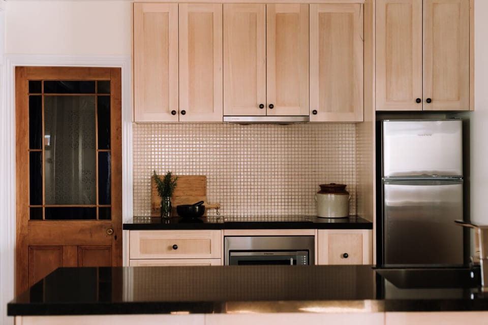 A new fully equipped kitchen with a dishwasher, cooktop, microwave 