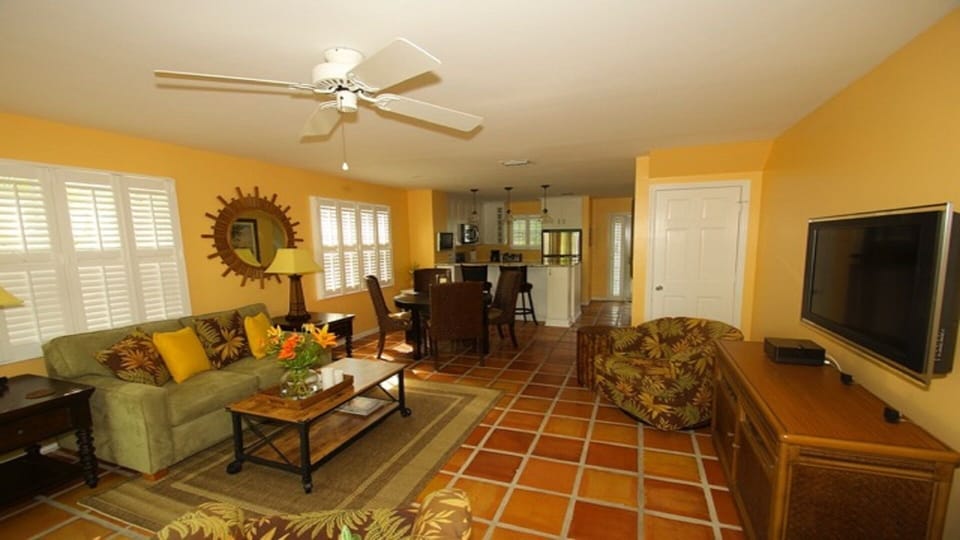 View of the living area from the back French doors.   
