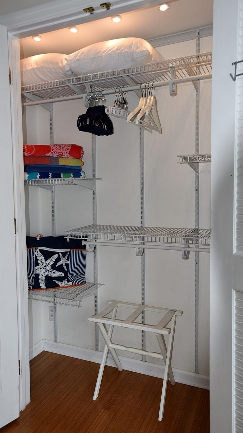 Large closet with plenty of hangers, extra pillows, beach towels and  beach bag.