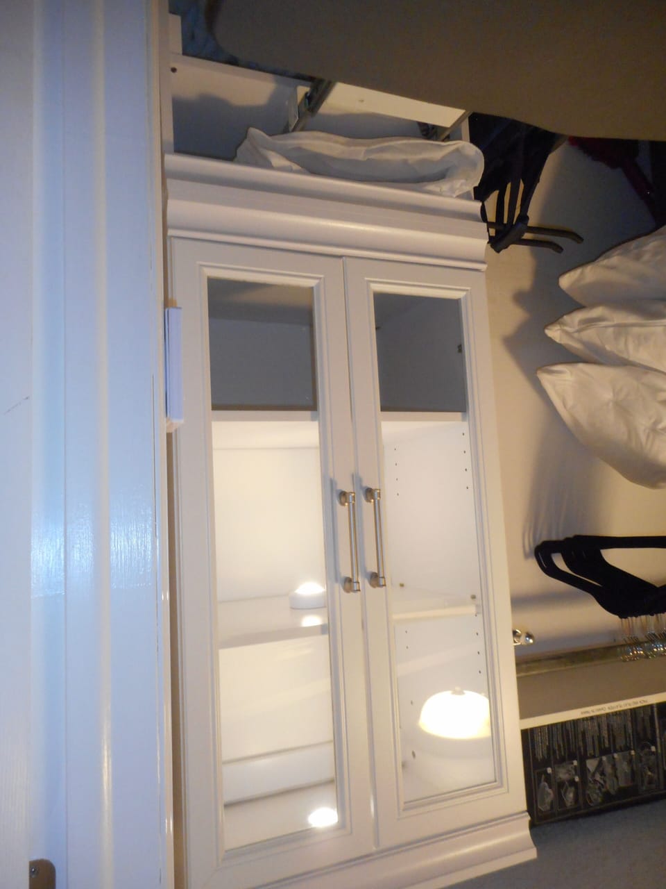 Cabinet with pull out ironing board inside the master walk in closet