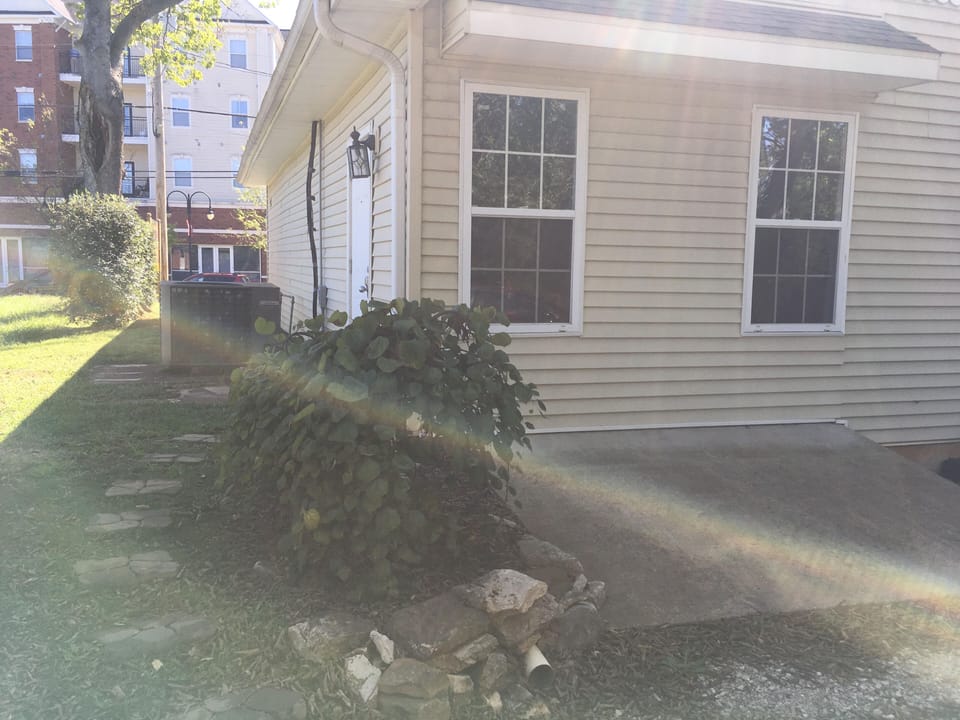 View of pathway from parking lot to back door (with keypad)