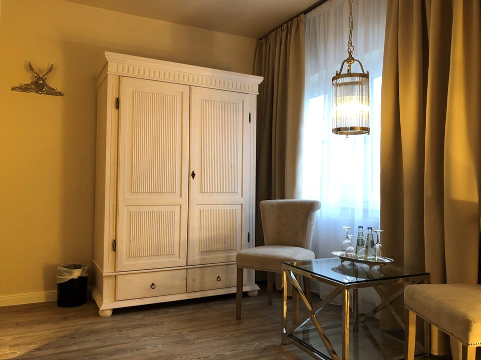 Deluxe Double Room | Living area | 49-inch Smart TV with satellite channels, TV