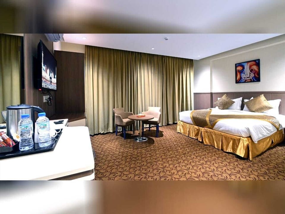 Double Room | Minibar, in-room safe, blackout drapes, iron/ironing board