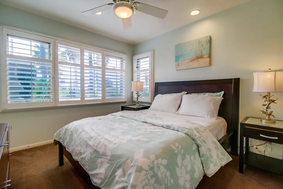 One of two additional bedrooms on lower level with queen bed.