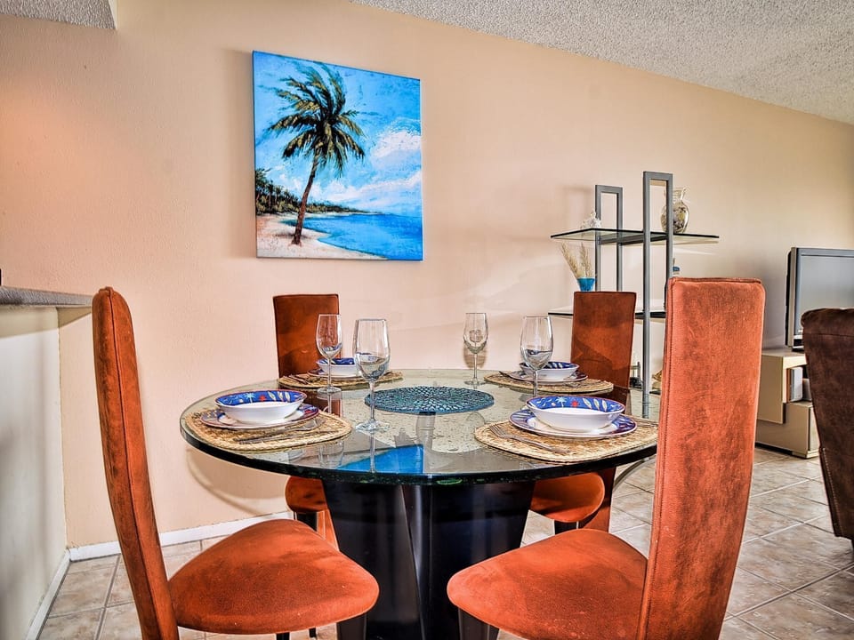 Dining area has seating for 4 guests.