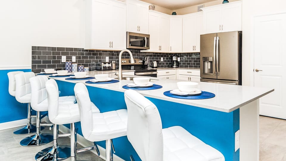 Compact and stylish with a mini breakfast bar, offering a cozy space for quick and casual dining