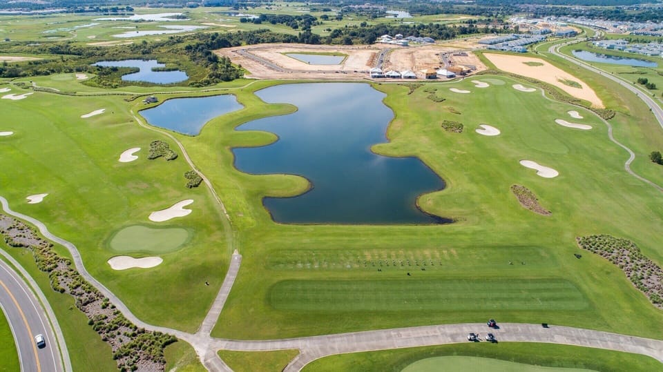 Scenic links featuring a picturesque lake, offering a tranquil and enjoyable setting for golf enthusiasts