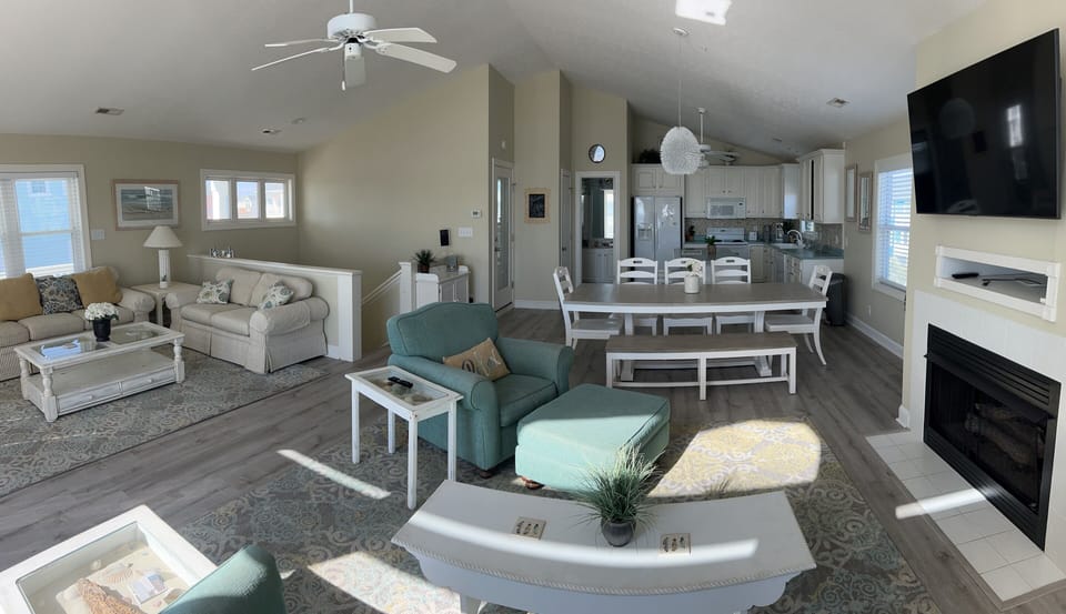 Two separate sitting areas in living space on top floor.