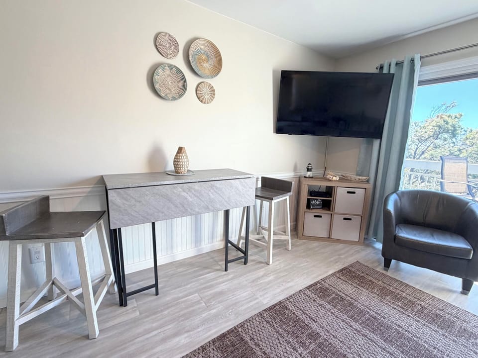 Dining table plus 2 chairs at the kitchen island