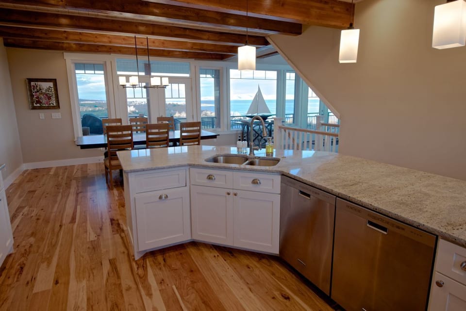 Kitchen with two dishwashers and dining area. Dining table expands to seat 14.