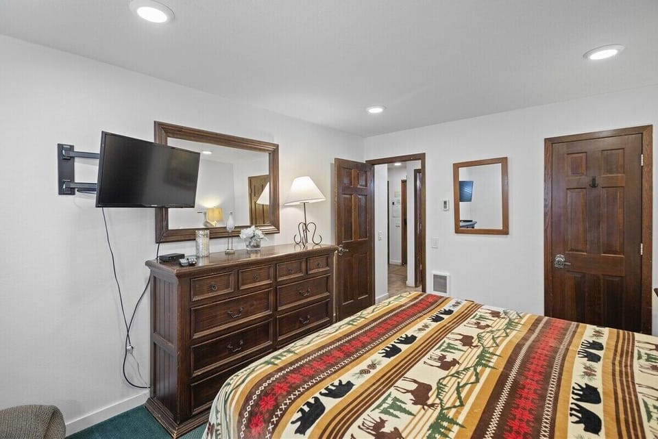 Bedroom with Dresser Storage and Flat Screen TV