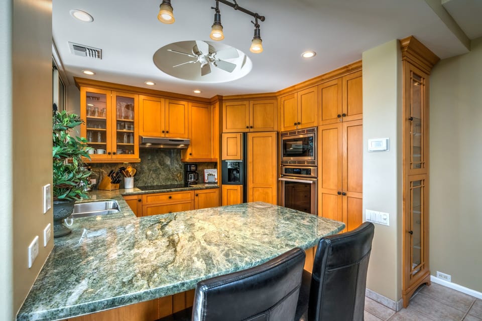 Kitchen features a full size wall oven, microwave and warming drawer.