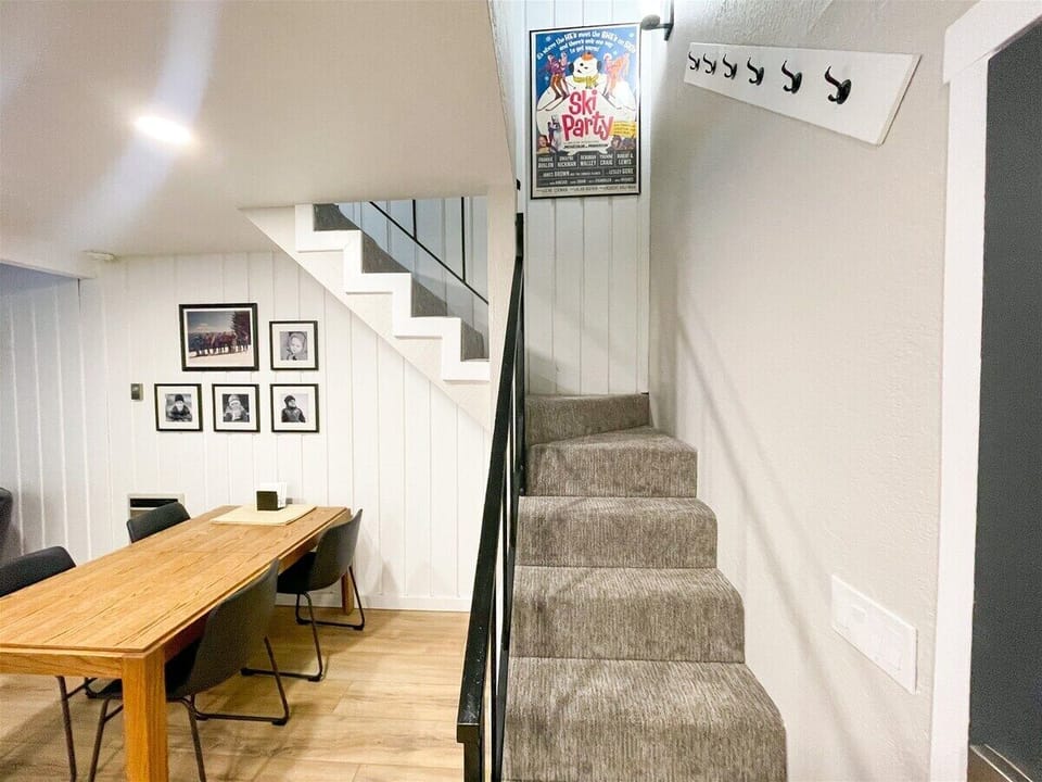 Stairs to the loft off the front door and dining room