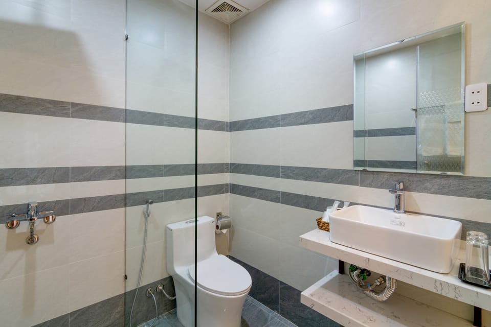 Shower, free toiletries, hair dryer, slippers