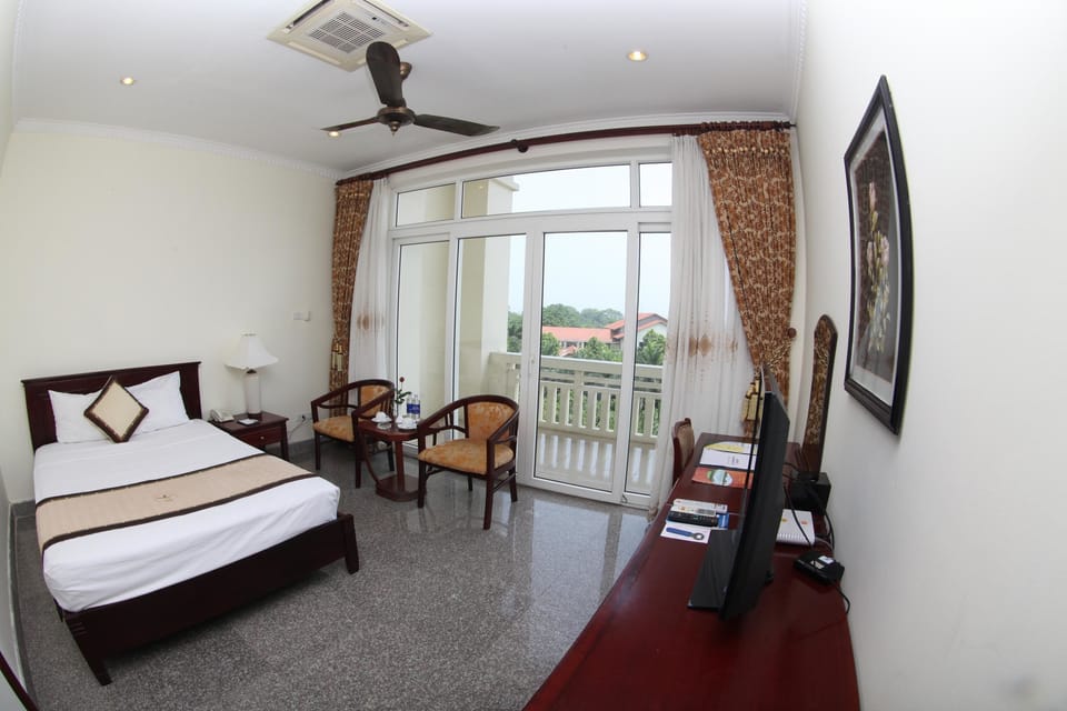 Standard Double Room | Minibar, in-room safe, desk, blackout drapes