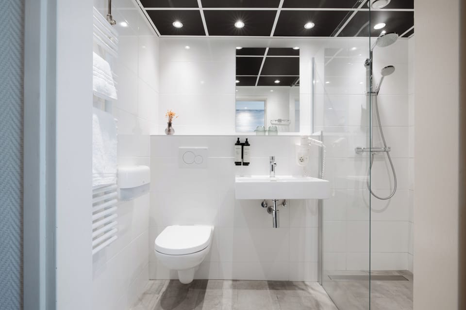 Eco-friendly toiletries, hair dryer, towels