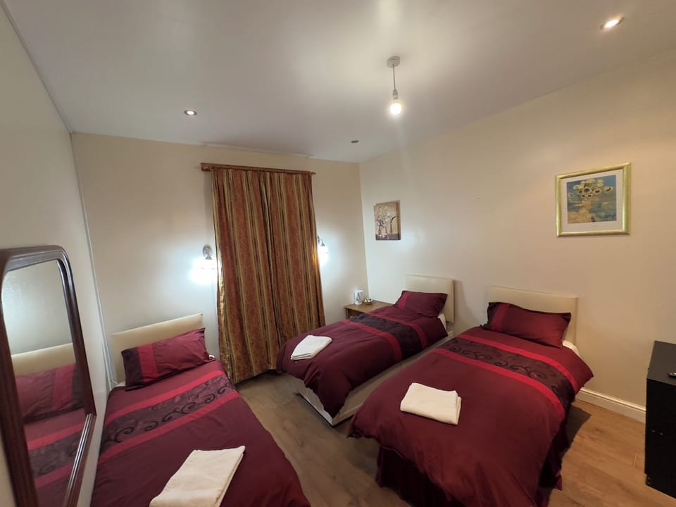 Family Triple Room (3 Adults) | Soundproofing, iron/ironing board, free WiFi