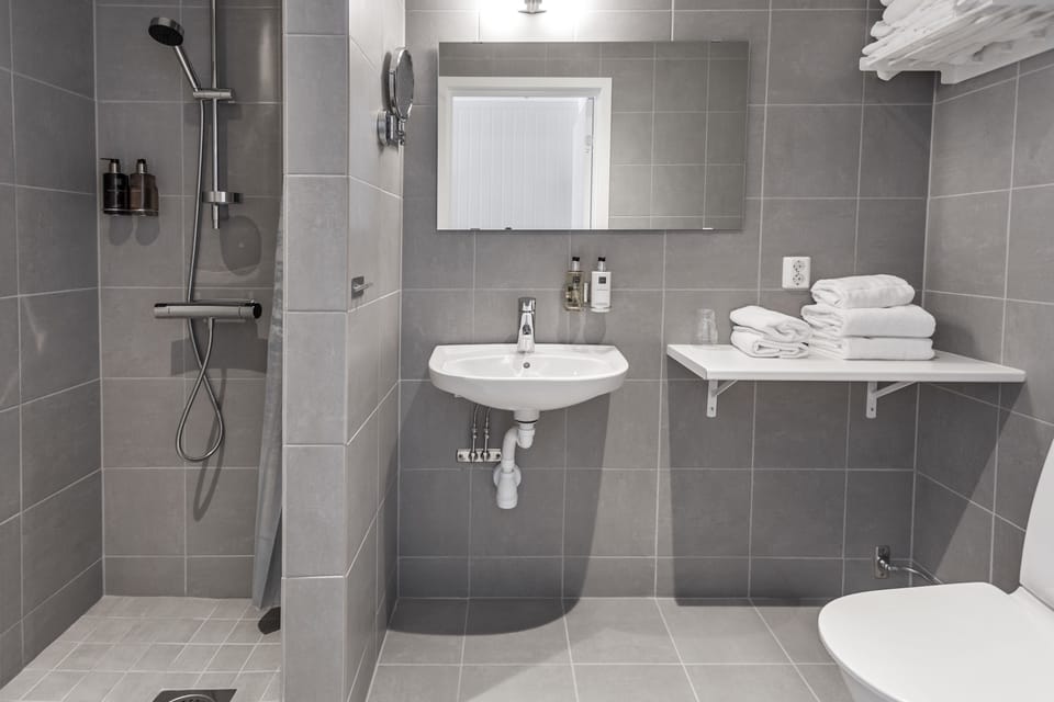 Designer toiletries, hair dryer, towels