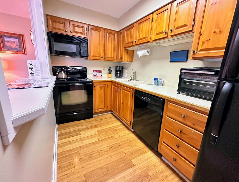 Kitchen: stocked for all your basic cooking needs and includes drip coffee maker.
