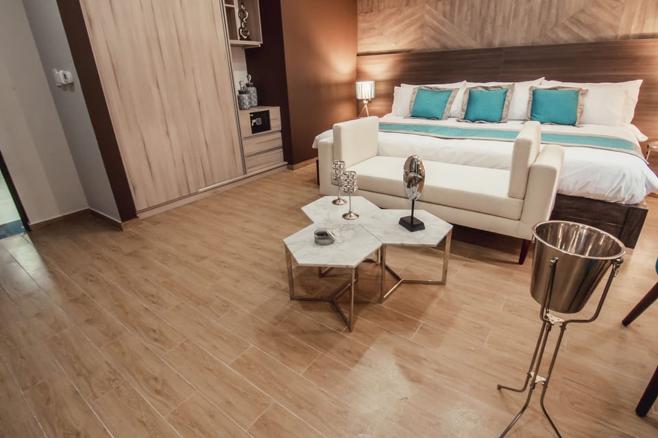 Deluxe Suite, Non Smoking | Hypo-allergenic bedding available, down comforters, minibar