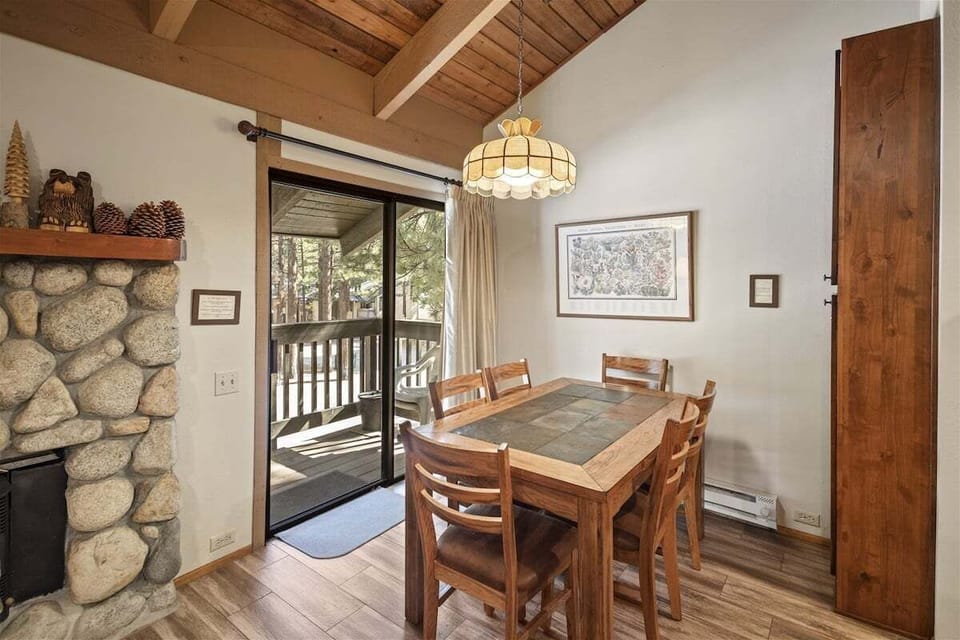 Dining Room with New Flooring and Slider to Private Outside Balcony