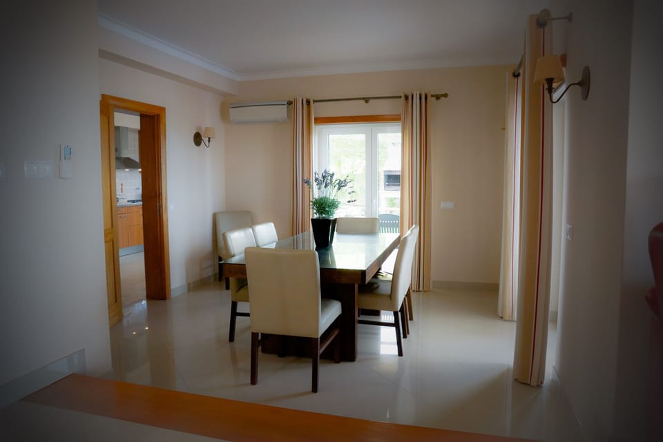Dining room with double doors opening on to the terrace and sea views. 