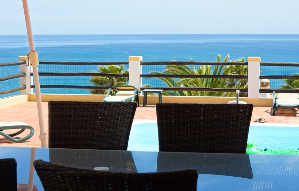 Outdoor dining on one of the covered terraces. A view from all seats.