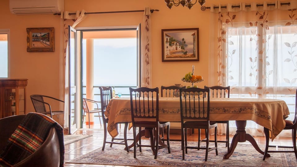 Expansive dining area with ample room for gatherings, featuring tasteful decor and a welcoming atmosphere for enjoyable and memorable dining experiences. #diningroom #oceanview