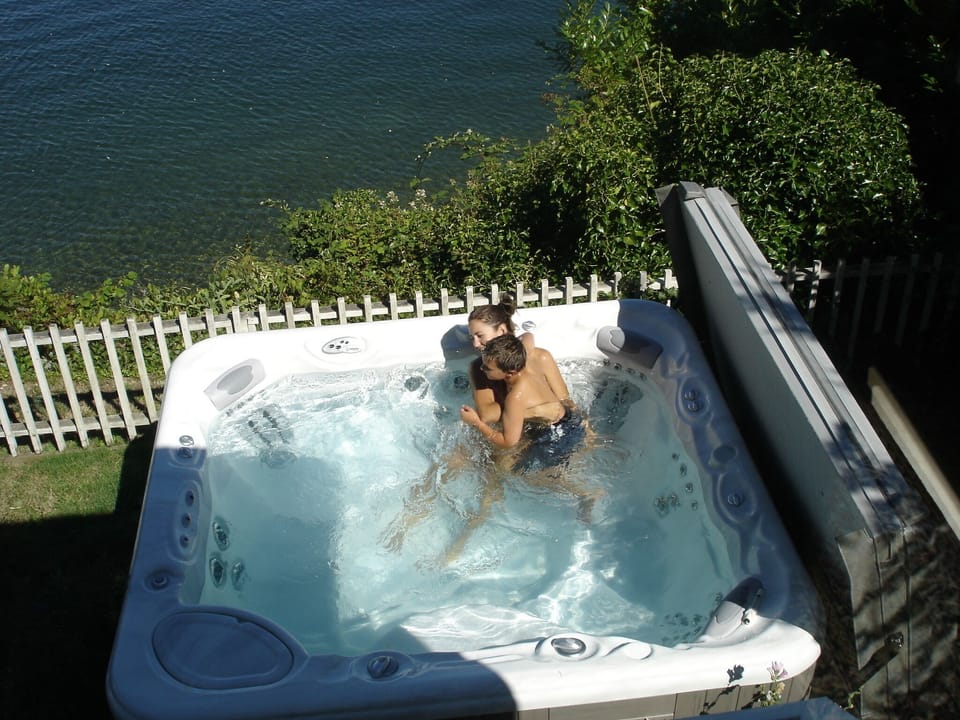The 8-person, silver-iode hot tub overlooks the beach, yet completely private.