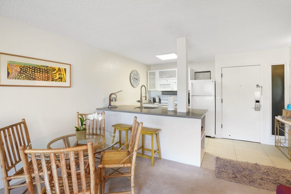 Eat at the dining room table .. or grab a snack sitting on the yellow bar stools