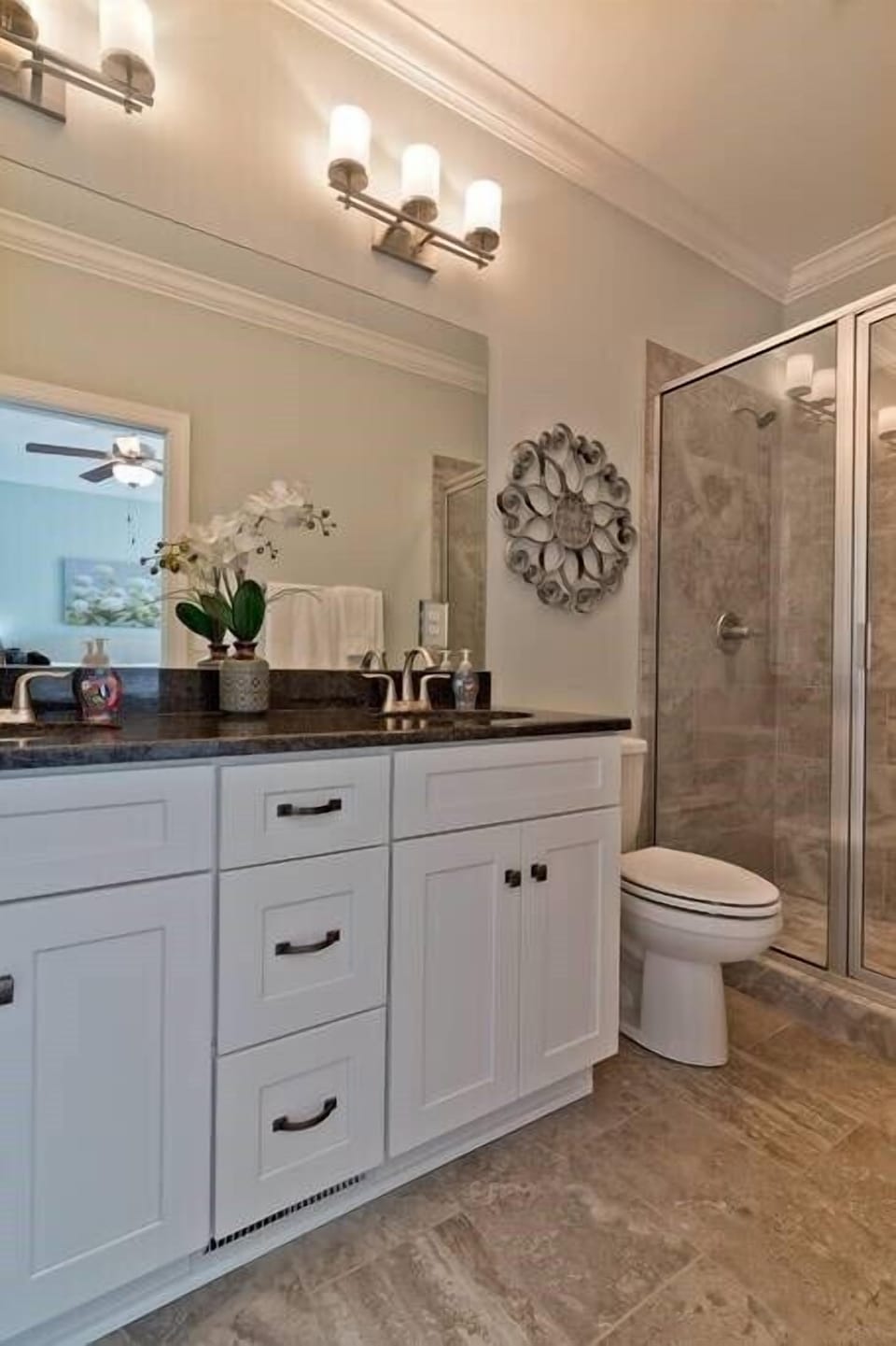 There is lots of light in our clean bathroom.
