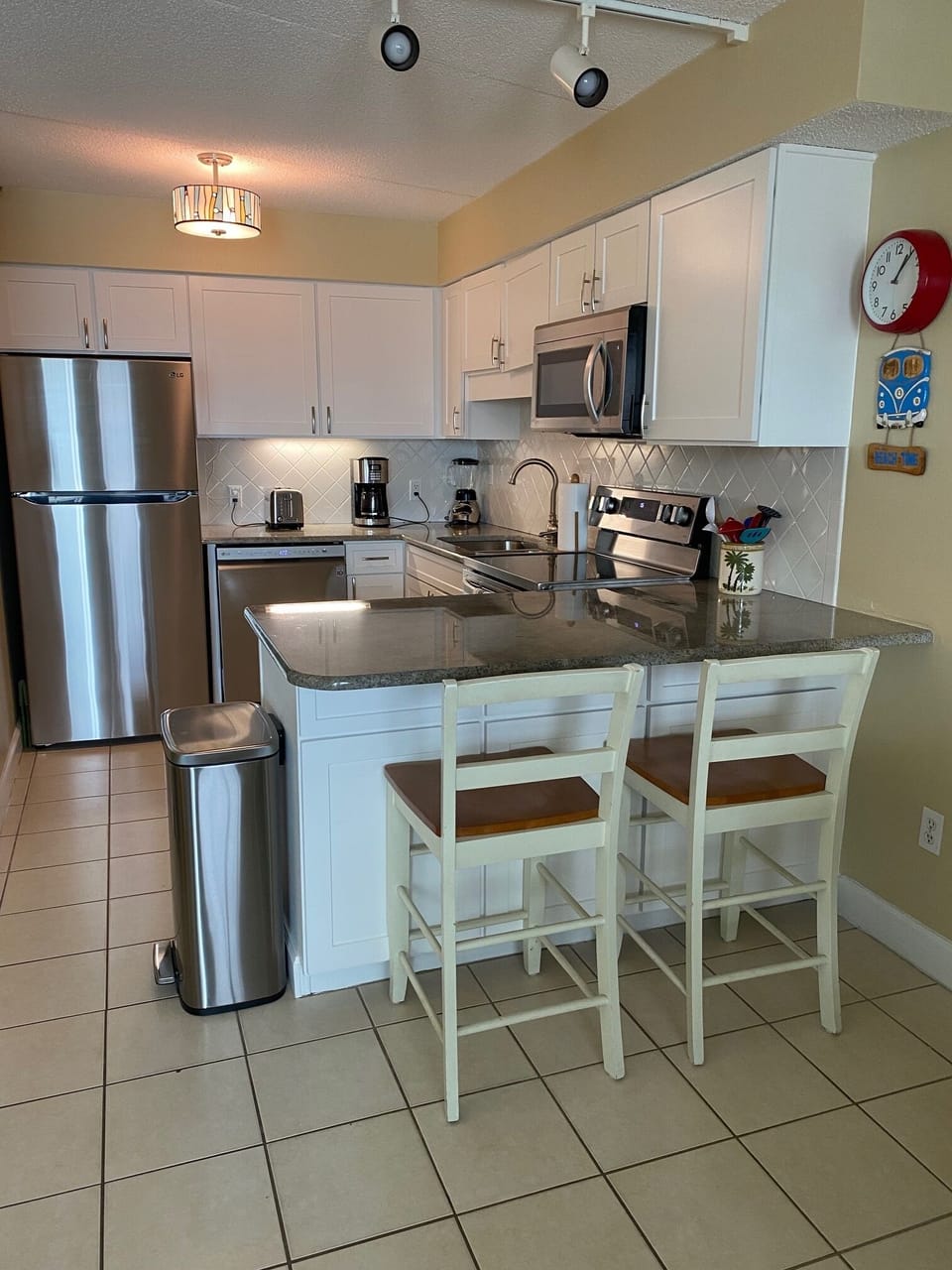 Breakfast bar seating and a view of the beach from the kitchen 