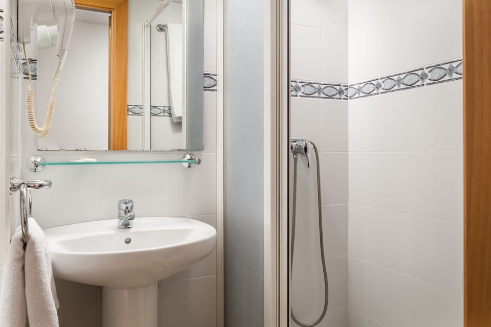 Shower, free toiletries, hair dryer, towels