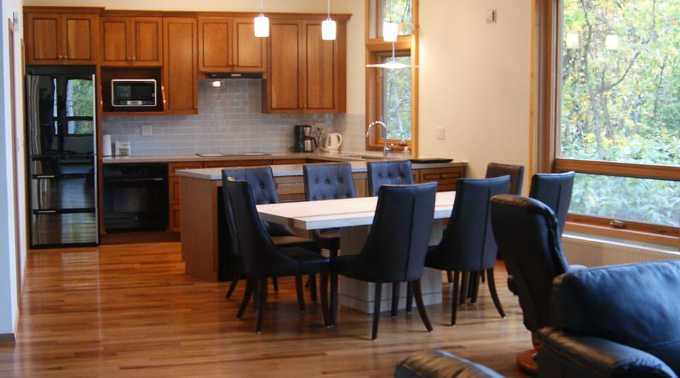 Dining area (seats 8) and full kitchen. Solid hickory wood floors.