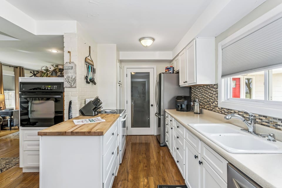Wall oven and stove, pantry, dishwasher butcher block countertop + storage