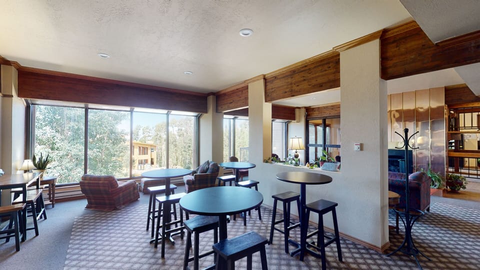 Work/Dinning area at Copper Lounge w/ Guest Kitchen, Sports TV, FREE Air Hockey