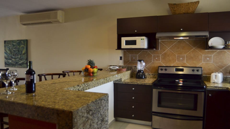 Fully appointed kitchen with island seating area. 