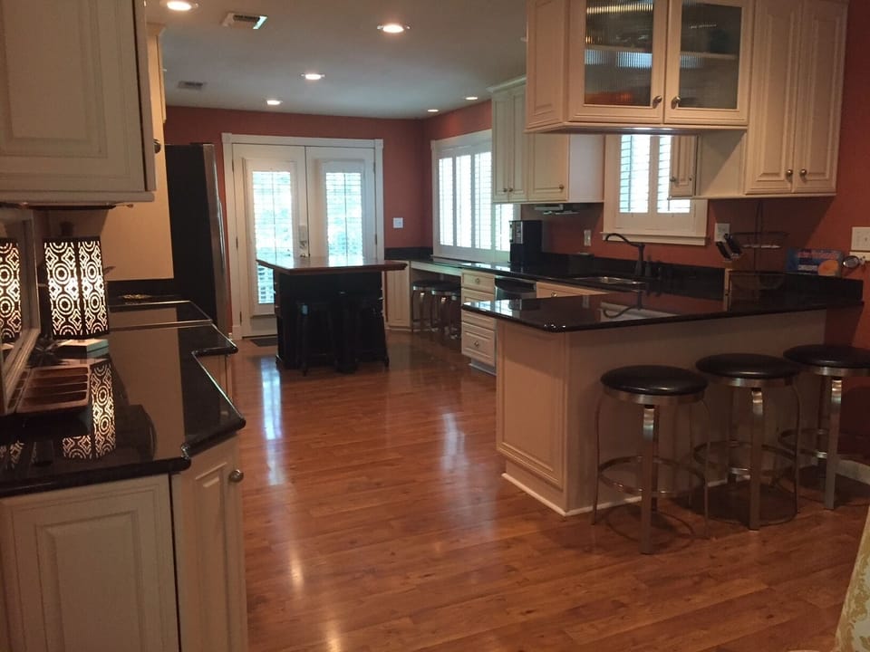 Gruene River Home Gourmet Kitchen, Bars, and Dining Area, from Living Room.