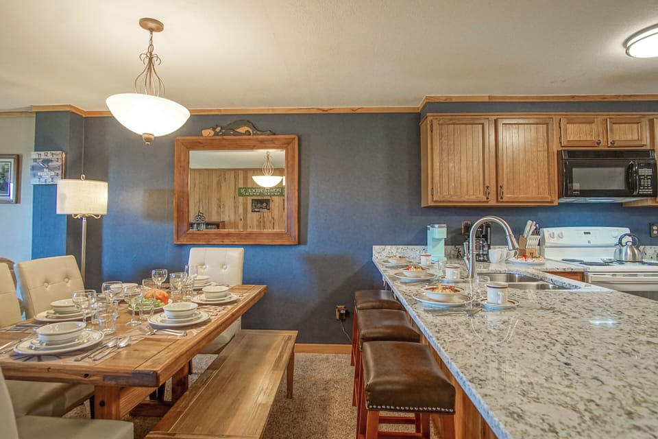 Dining area for six and seating for three at the kitchen counter/island