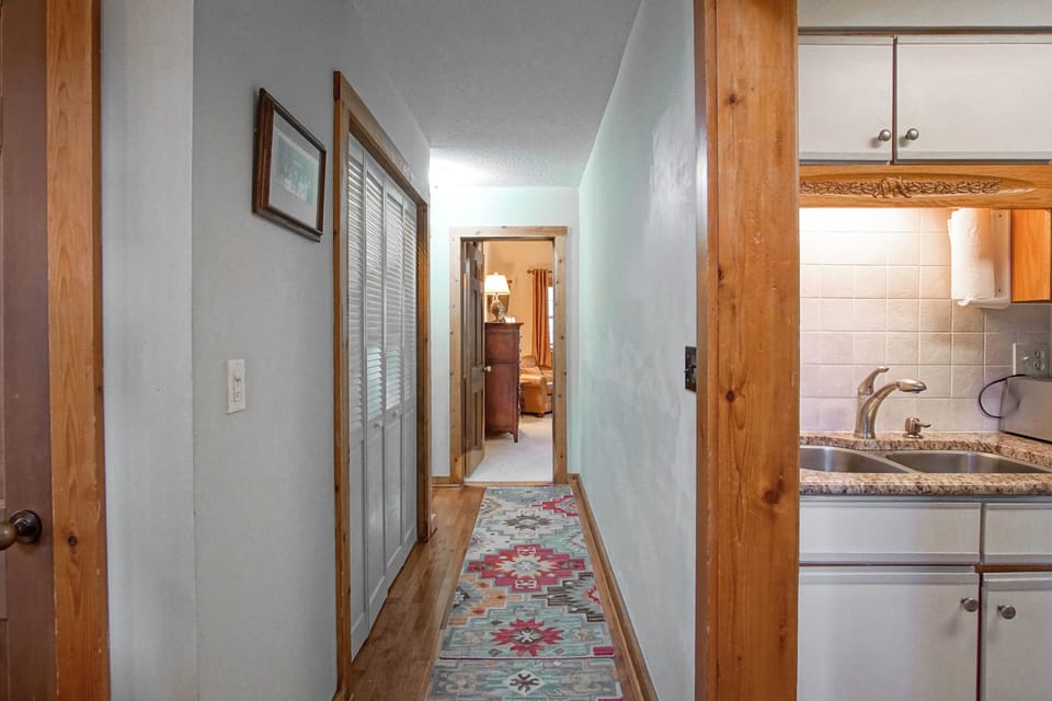This hallway leads to the bedrooms and the bathrooms on the main level.
