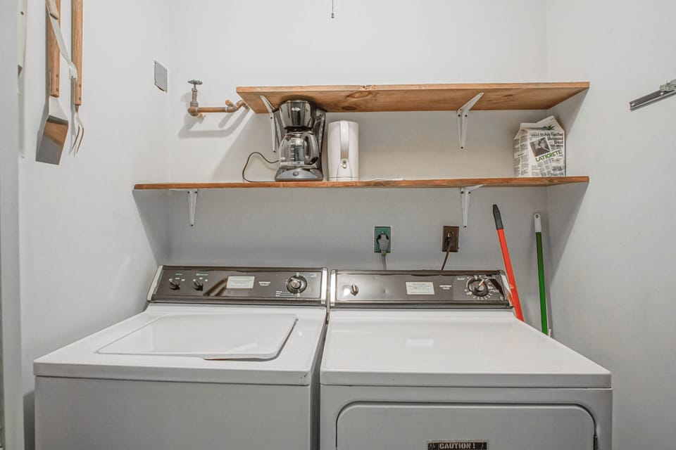 The washer and dryer are behind the bifold doors in the hallway on the main level.