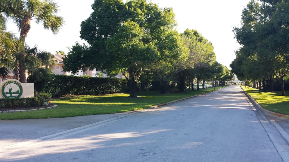 End of this tree lined road you have PGA Clubhouse. Yes..You can walk there