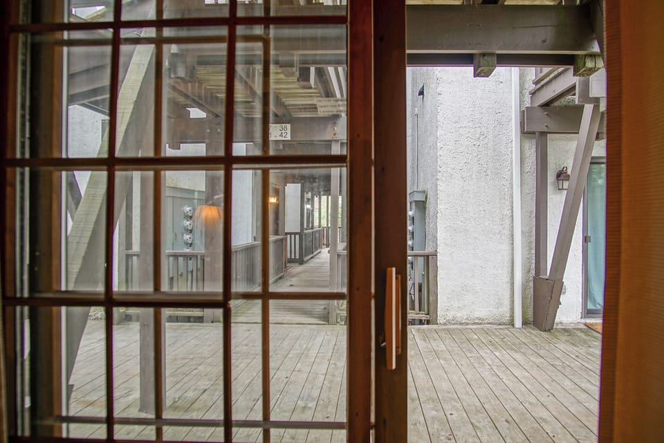 The patio doors lead out to the main walkway of this building!