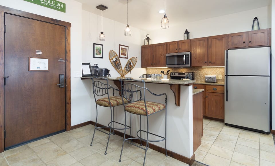 The kitchen bar has seating for 2.