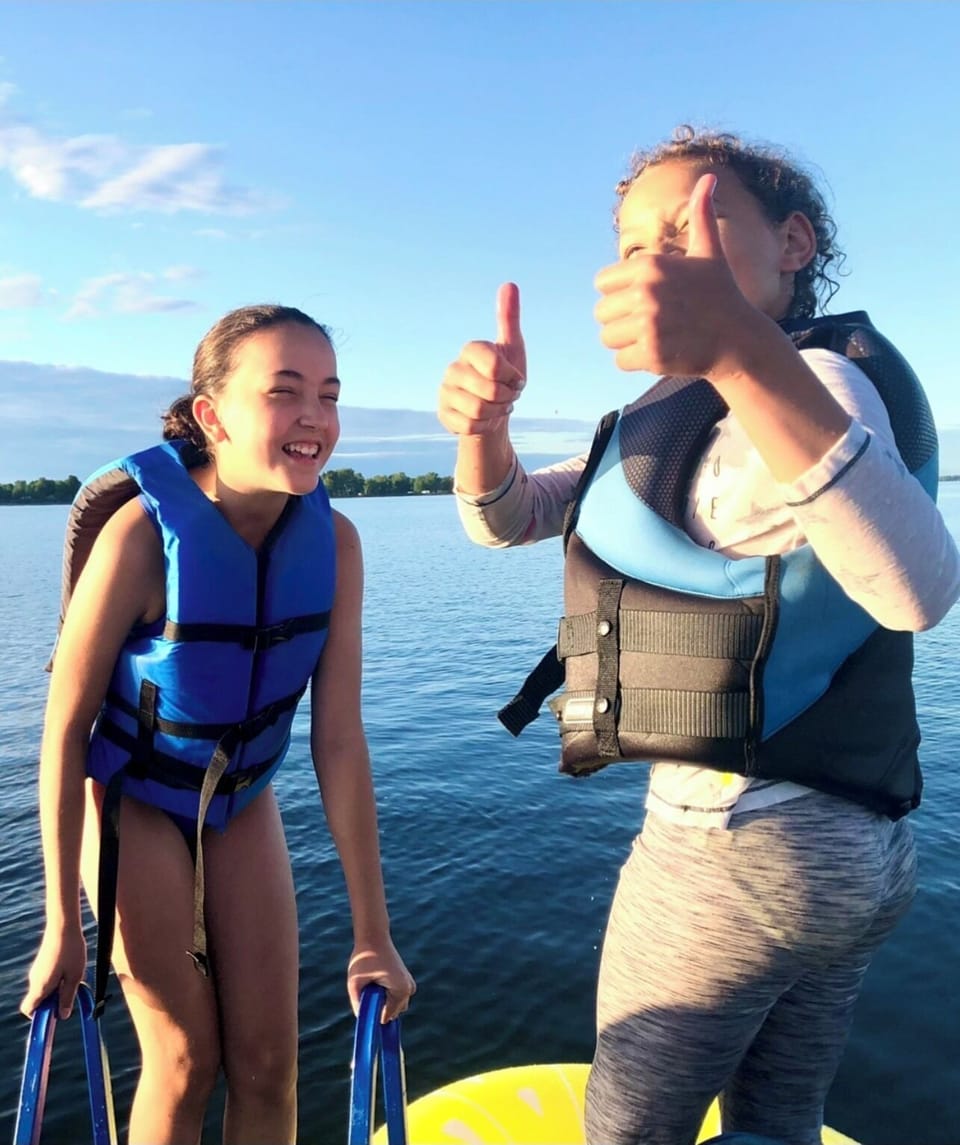 Swimming off the dock, many life jackets provided.