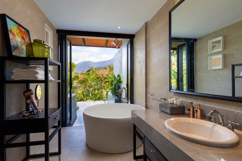 Mountain View Pool Suite | Bathroom | Shower, rainfall showerhead, designer toiletries, hair dryer