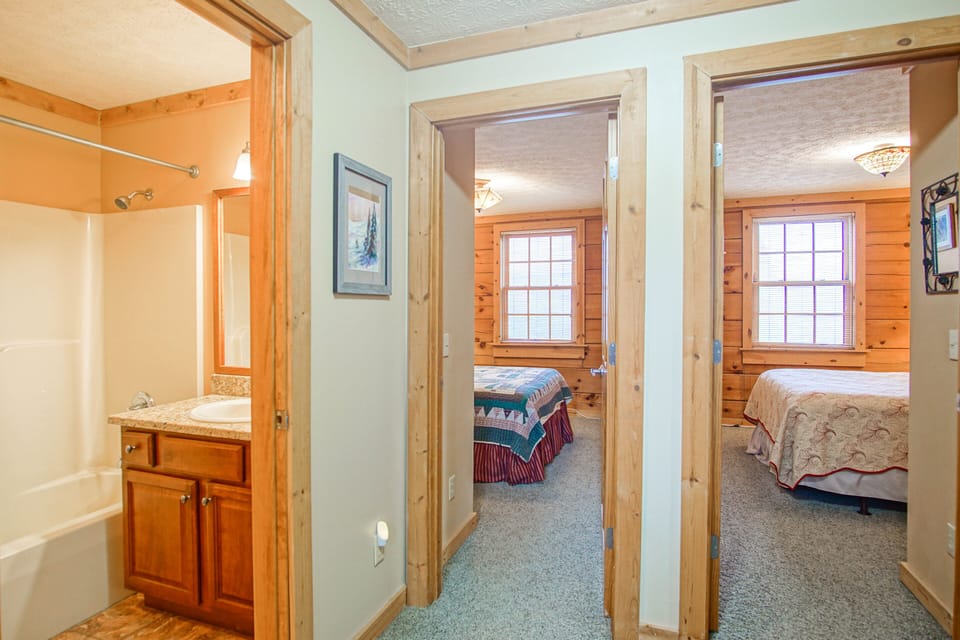 Here you can see 2 bedrooms on the top level and the shared bathroom in the hall.
