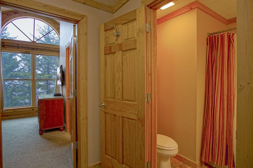 Shared hall bathroom on the top level.