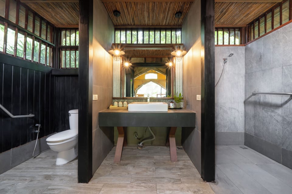 Shower, designer toiletries, hair dryer, slippers