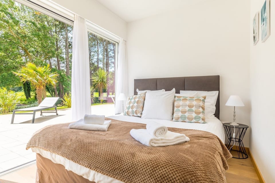 Enjoy the luxurious bedding in the bedroom.